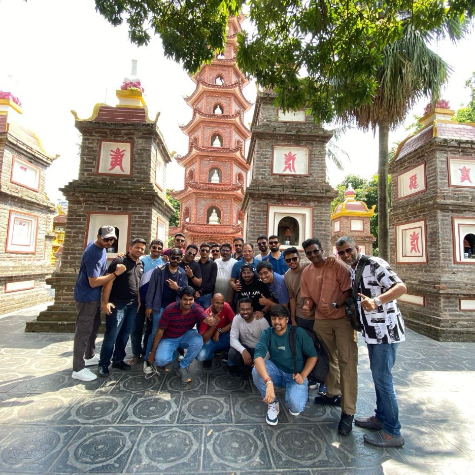 Group tour at a traditional Vietnamese pagoda courtyard